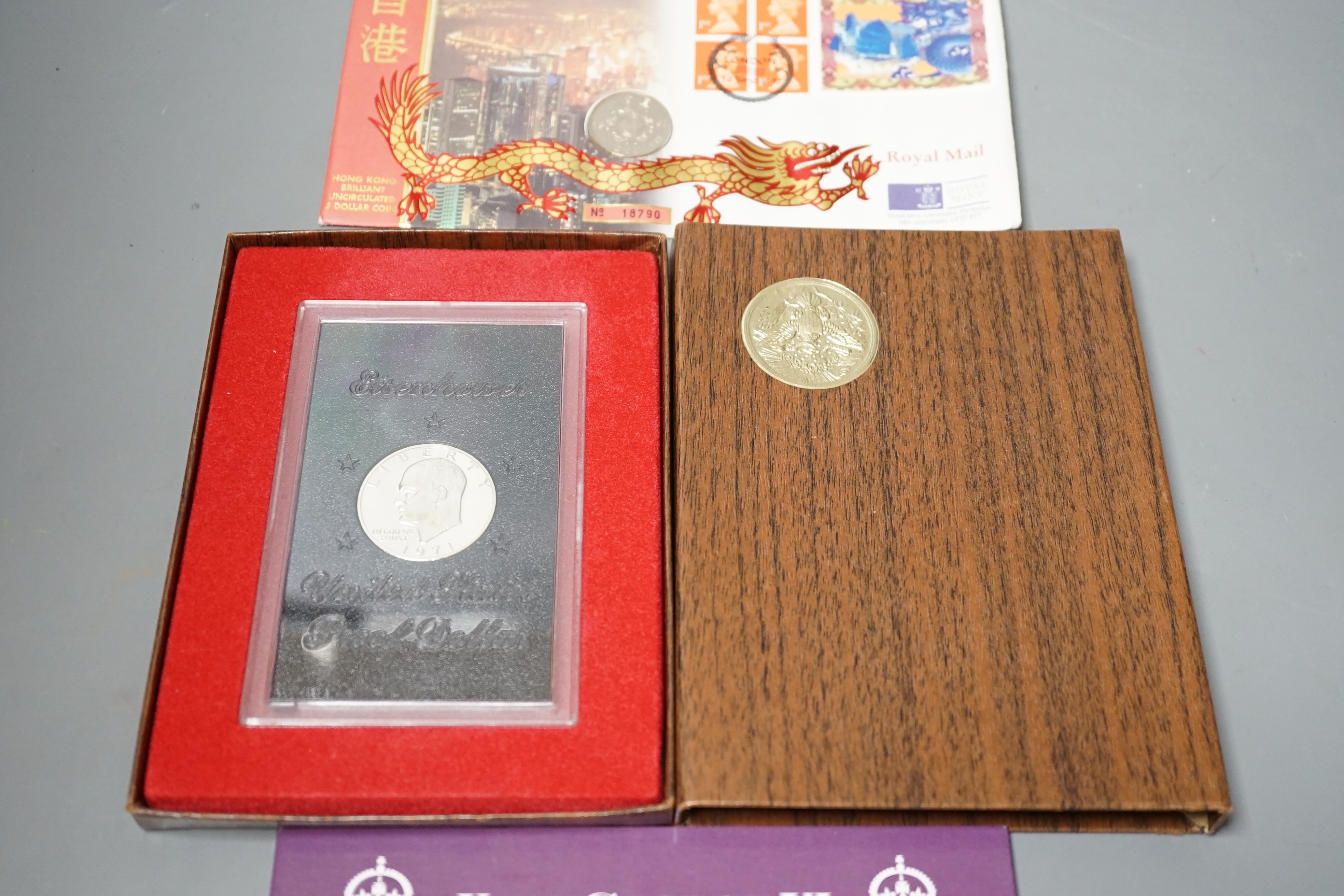 A group of QEII Royal Mint coin years sets, commemorative crowns, £5, £2 and George VI stamp, British Armed Forces £1 and coin set